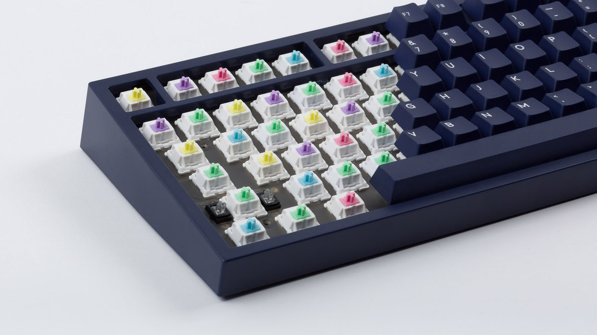  dark blue NK87 case with included dark milkshake themed keycaps and exposed switches 