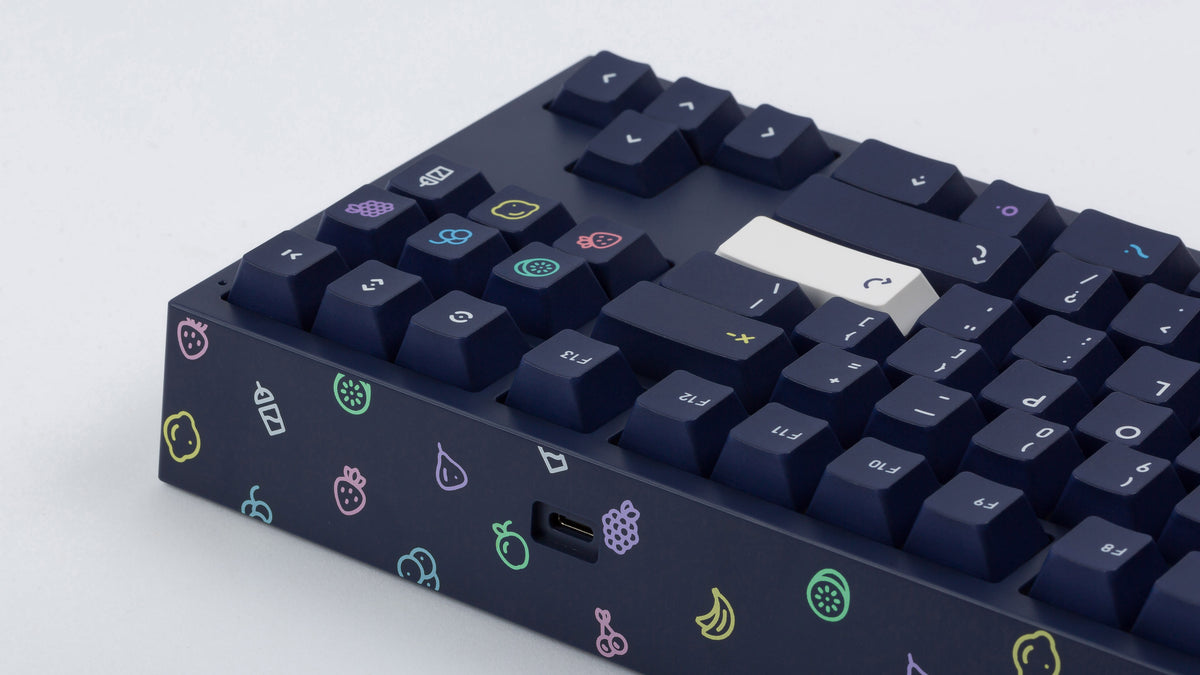  dark blue NK87 case with included dark milkshake themed keycaps  closeup of back view right side 
