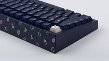 Load image into Gallery viewer, dark blue NK87 case with included dark milkshake themed keycaps  close up of back view