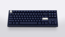 Load image into Gallery viewer, dark blue NK87 case with included dark milkshake themed keycaps 