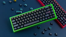 Load image into Gallery viewer, both green and pink case featuring awaken keycaps stacked with keycaps