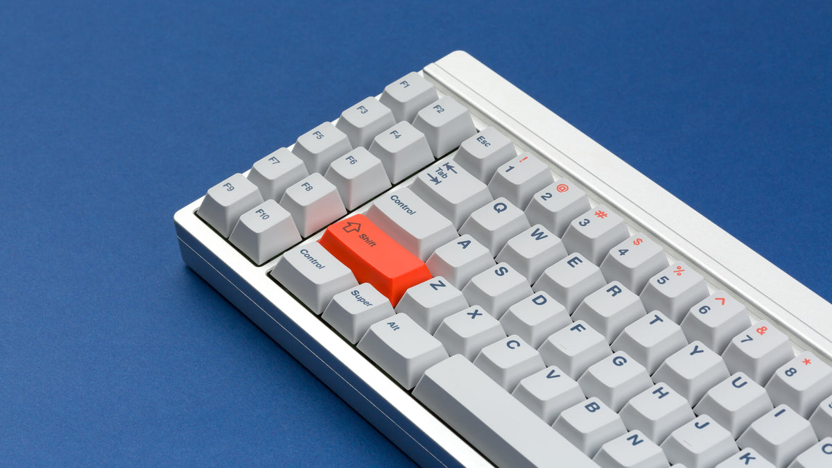  Cherry Industrial Keys on a silver keyboard zoomed in on left 