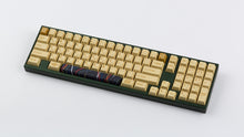 Load image into Gallery viewer, C-3PO keycaps on a dark green keyboard