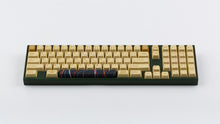 Load image into Gallery viewer, C-3PO keycaps on a dark green keyboard