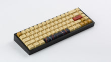 Load image into Gallery viewer, C-3PO keycaps on a black NK65 angled