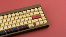 Load image into Gallery viewer, C-3PO keycaps on a brown keyboard zoomed in on the right