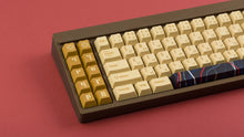 Load image into Gallery viewer, C-3PO keycaps on a brown keyboard zoomed in on the left