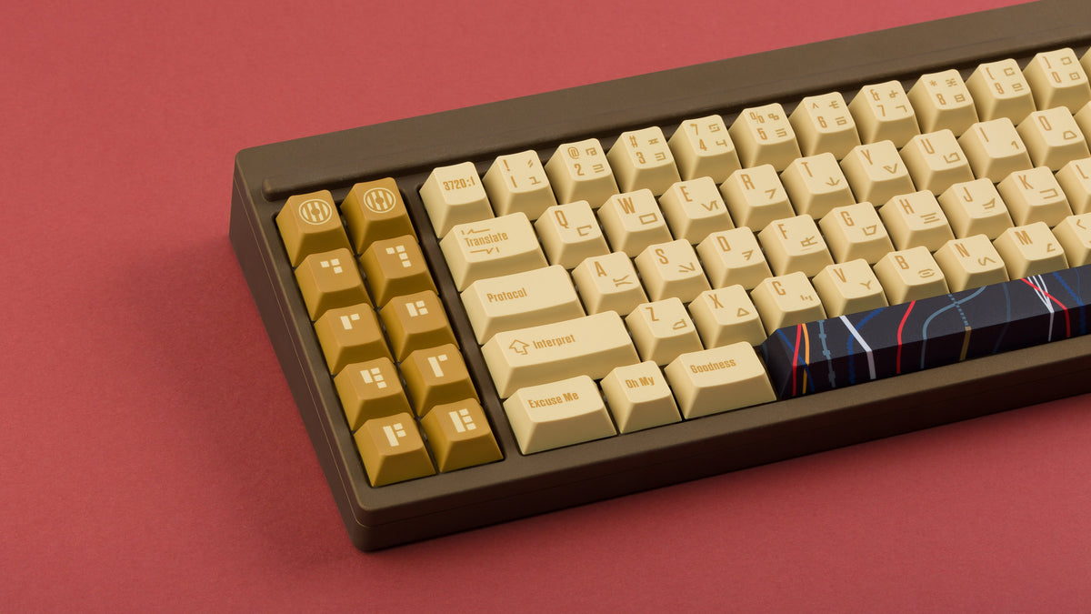  C-3PO keycaps on a brown keyboard zoomed in on the left 