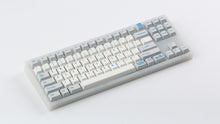 Load image into Gallery viewer, R2-D2 keycaps on a translucent NK87