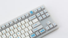 Load image into Gallery viewer, R2-D2 keycaps on a translucent NK87 zoomed in on the right