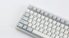 Load image into Gallery viewer, R2-D2 keycaps on a translucent NK87 zoomed in on the left