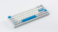 Load image into Gallery viewer, R2-D2 keycaps on a white NK65 angled