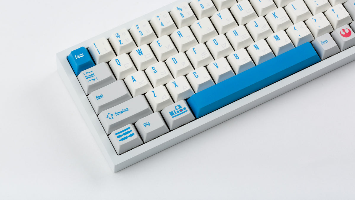  R2-D2 keycaps on a white NK65 zoomed in on the left 