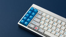 Load image into Gallery viewer, R2-D2 keycaps on a silver keyboard zoomed in on the left