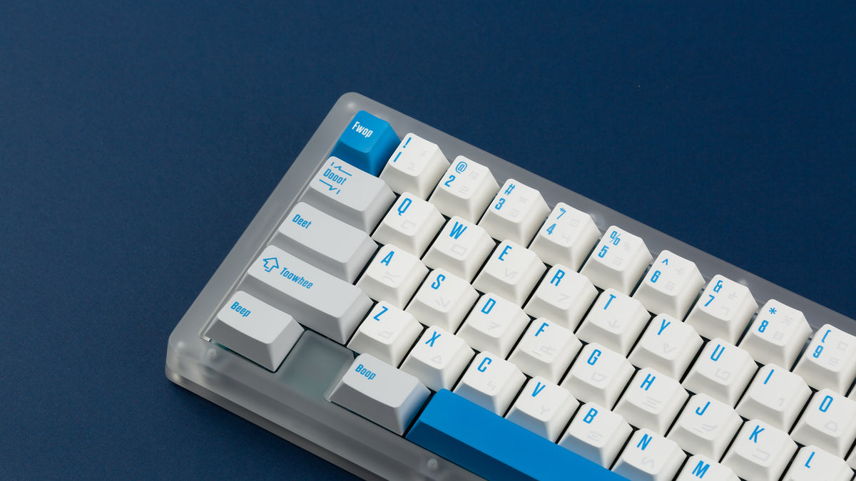  R2-D2 keycaps on a translucent keyboard zoomed in on the left 