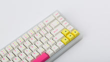 Load image into Gallery viewer, TFUE Keycaps on a translucent NK65 Keyboard zoomed in on right