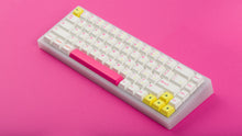 Load image into Gallery viewer, TFUE Keycaps on a translucent NK65 Keyboard tilted