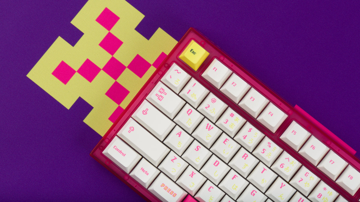  pink tfue themed keyboard with tfue keycaps closeup of left side on purple tfue deskpad 