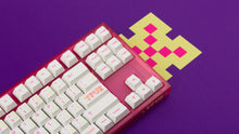 Load image into Gallery viewer, pink tfue themed keyboard with tfue keycaps close up of right side on tfue purple deskpad