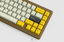 Load image into Gallery viewer, GMK CYL Serika 2 on a brownish gold keyboard zoomed in on right